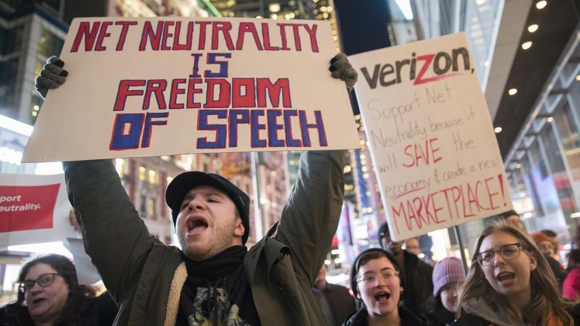 Demonstrators rally in support of net neutrality outside a Verizon store, Thursday, Dec. 7 in New York. The FCC is set to vote Thursday on whether to scrap Obama-era rules around open internet access that prevent phone and cable companies from favoring certain websites and apps.