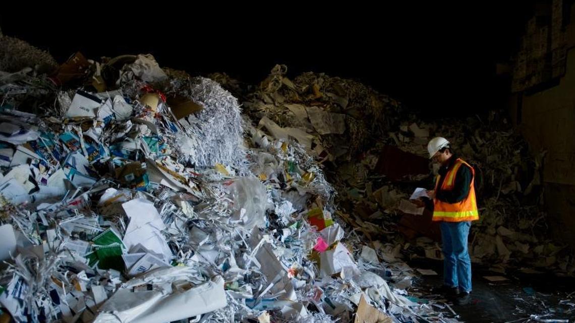 David Kuhnen, general manager of Recycling Industries in Sacramento, Calif., surveys a pile of scrap paper and other recycled material destined for China on Oct. 20, 2009. China this year has restricted imports of U.S. mixed paper and plastics, which are upsetting recycling markets but creating new opportunities.