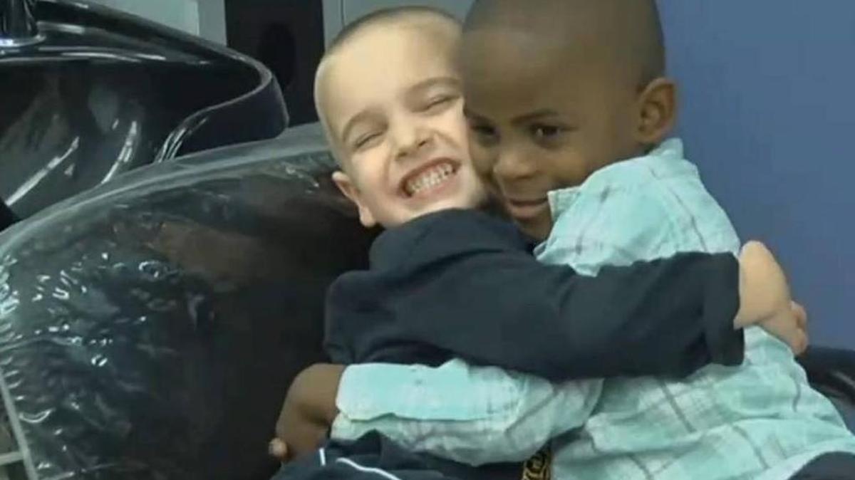 Jax Rosebush, left, asked his mom for a haircut that would make him look like his best friend, Reddy, so their teacher couldn’t tell them apart.