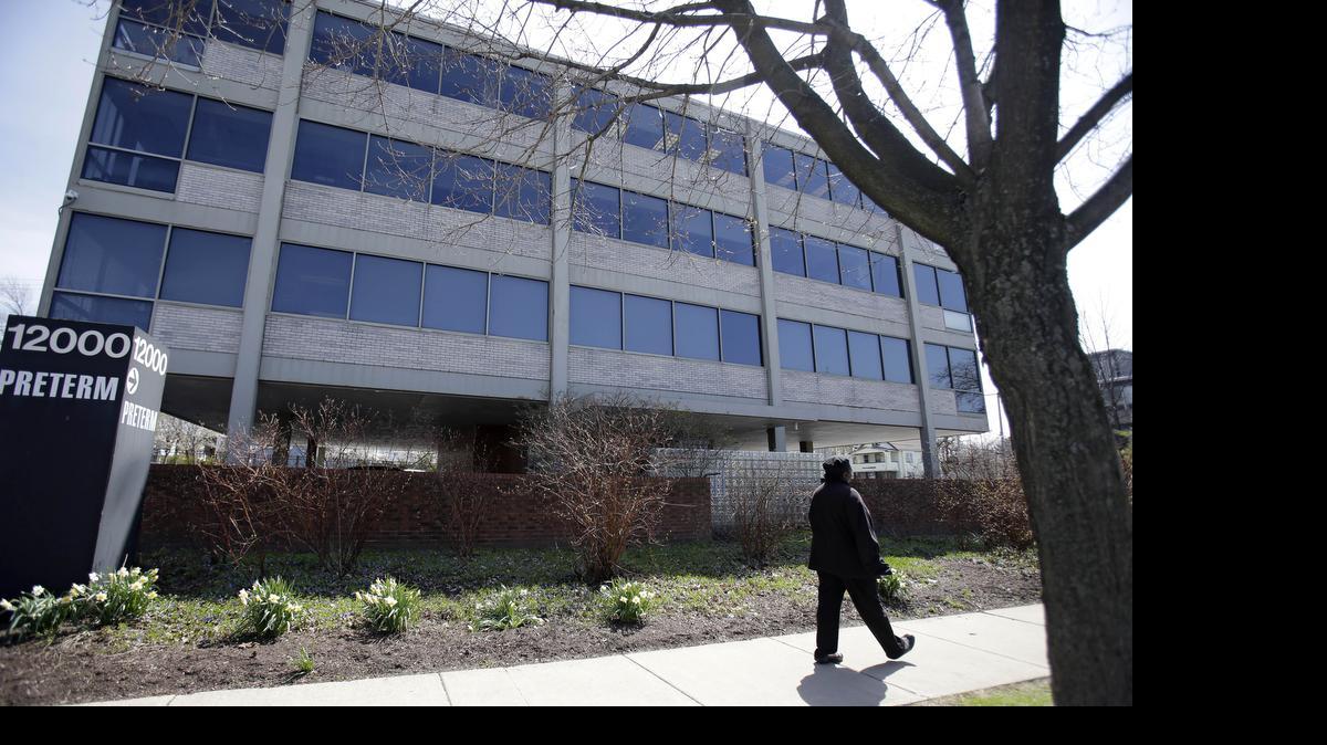 
A woman walks past Preterm, an abortion clinic that remains open despite Ohio’s restrictive abortion laws, in Cleveland on April 28. 
