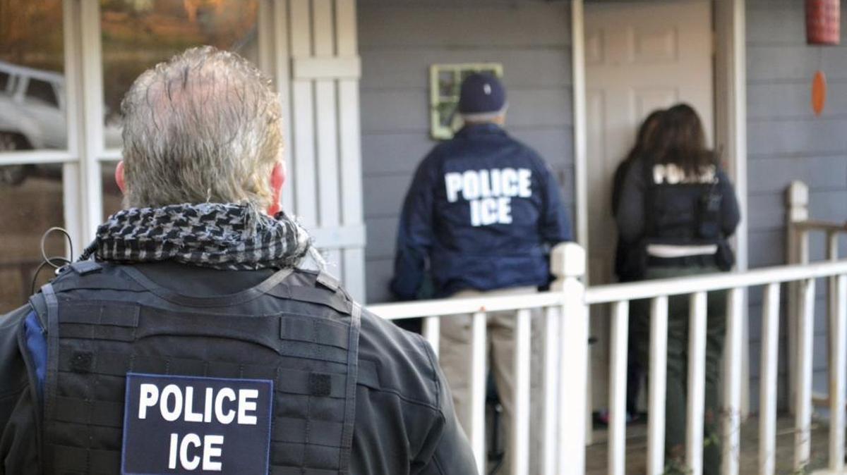 ICE agents at a home in Atlanta, during a targeted enforcement operation aimed at immigration fugitives, re-entrants and at-large criminal aliens in this Feb. 9, 2017, photo provided U.S. Immigration and Customs Enforcement.