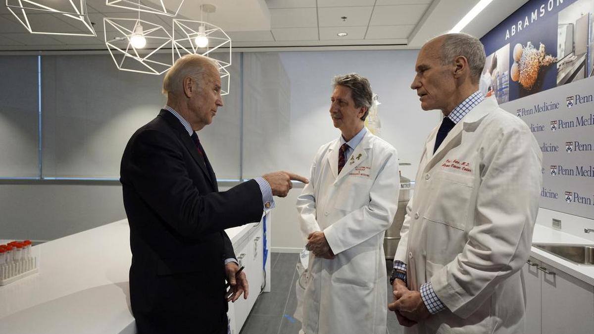 Vice President Joe Biden, left, gestures while speaking with Dr. Bruce L. Livine Ph.D., center, and Dr. Carl H. June M.D., Jan. 15, 2016, in the Abramson Cancer Center at the University of Pennsylvania in Philadelphia.