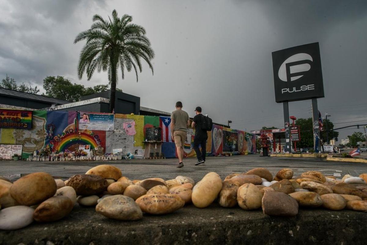 A year following the Pulse night club tragedy, the property remains covered with messages, candles, artwork, photos and memorabilia honoring the victims and survivors.