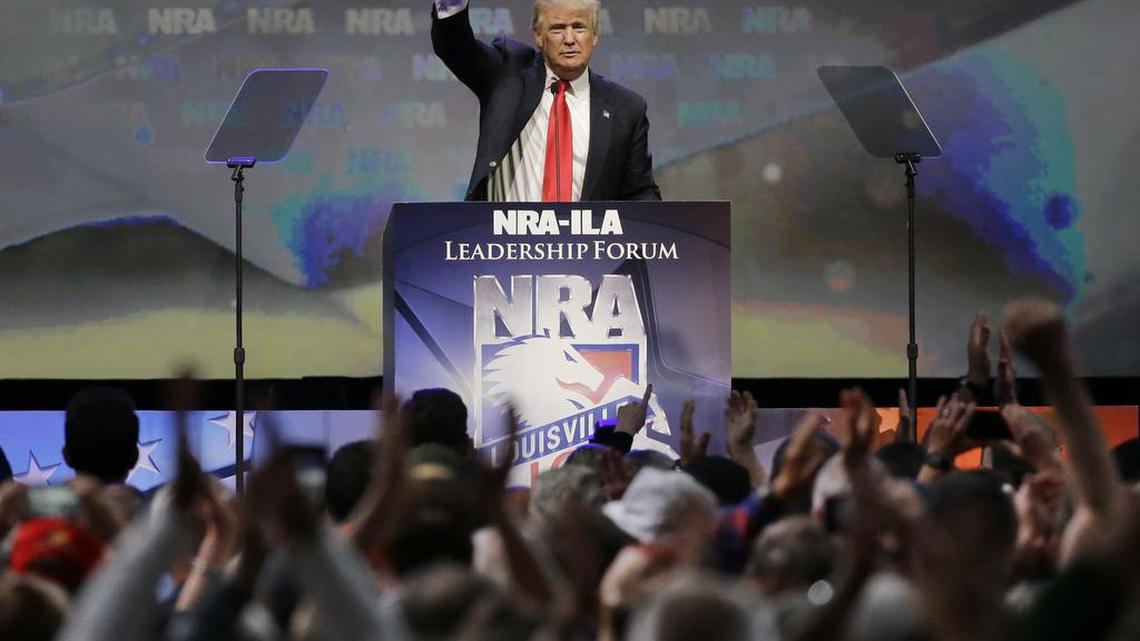 Republican presidential candidate Donald Trump waves to the crowd after speaking at the National Rifle Association convention on Friday.