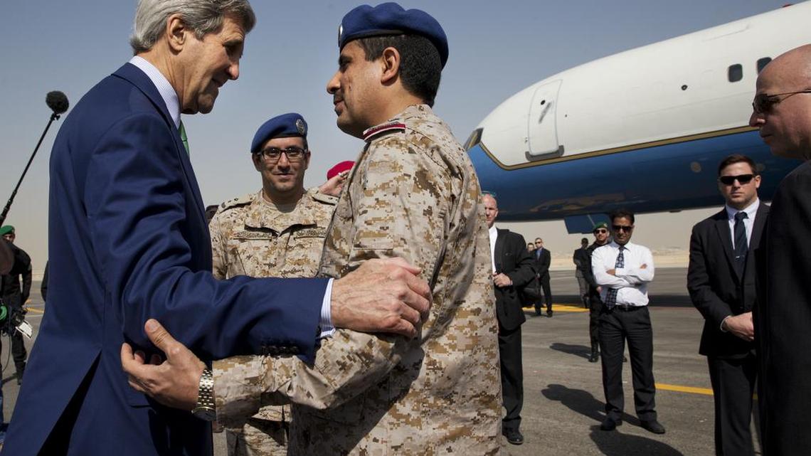 U.S. Secretary of State John Kerry says goodbye to Saudi Arabian military personnel as he leaves Riyadh, Saudi Arabia, Sunday, Jan. 24, 2016, en route to Vientiane, Laos.