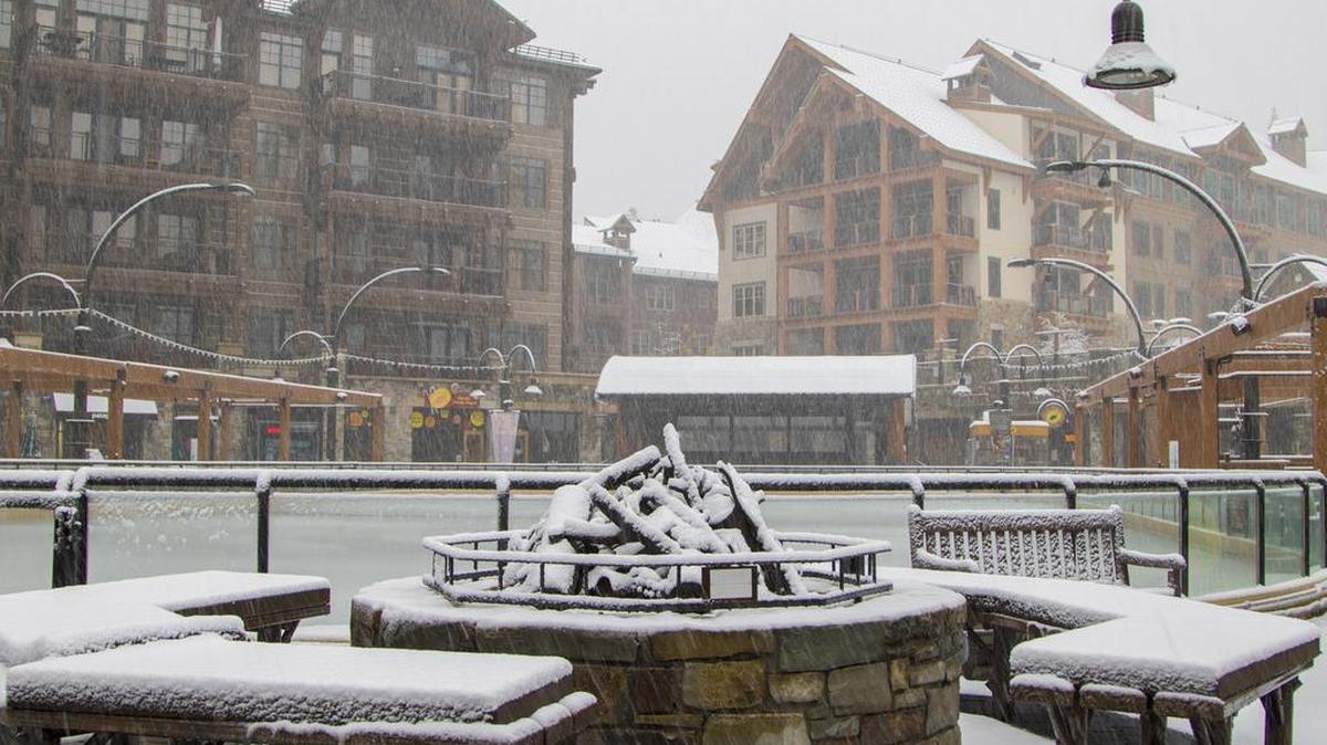 In this photo provided by Northstar California, snow falls on The Village at Northstar ski resort Monday, Nov. 2, 2015, in Truckee, Calif.