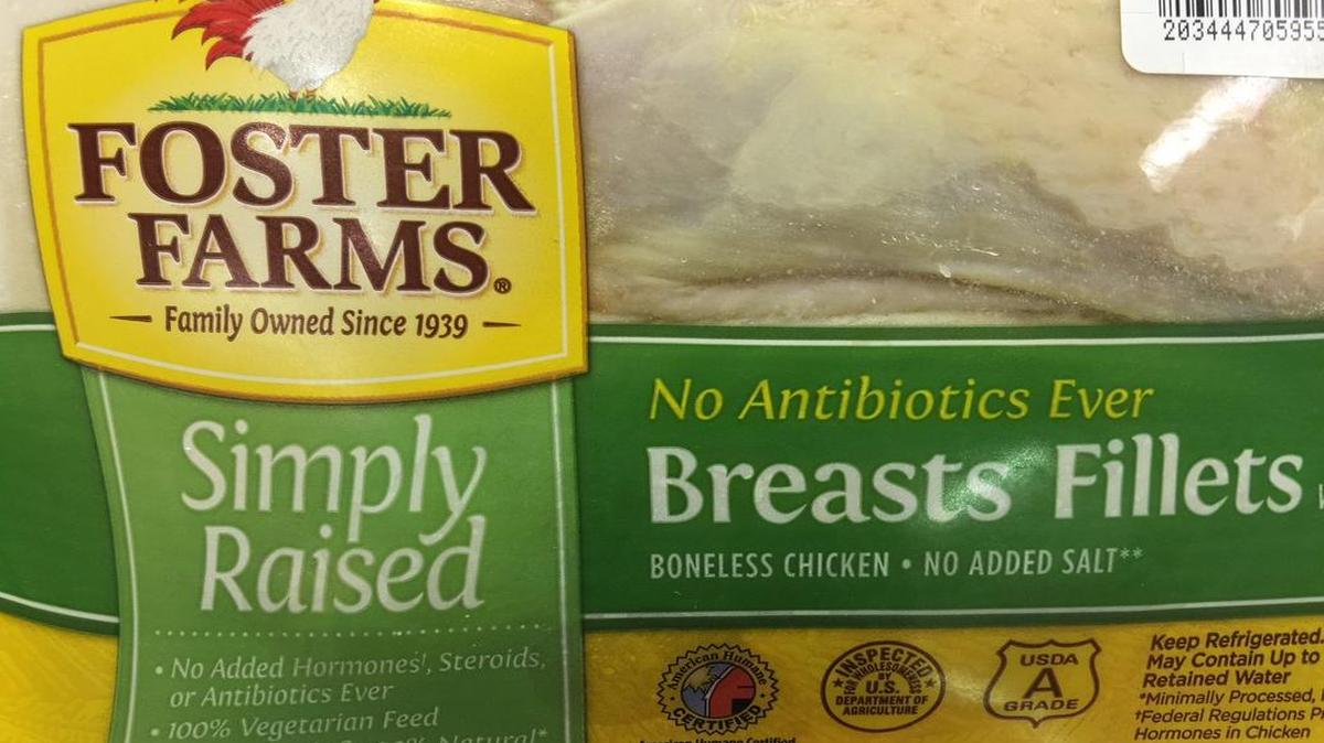 
A package of Foster Farms chicken breast fillets displays a certificate from the American Humane Society in this 2015 file photo. The animal rights group Mercy for Animals filed a lawsuit against Foster Farms and the American Humane Association on July 2, 2015, for marketing products as humane after producing an undercover video showing slaughterhouse workers hitting chickens and pulling off their feathers before they were killed.

