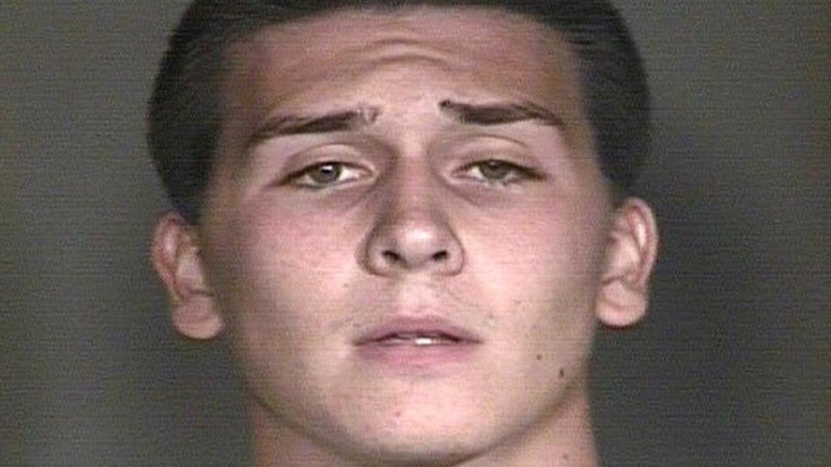 Hunter Osborn, an Arizona high school student, is facing dozens of charges after police say he exposed himself in a football team picture that ended up in a yearbook.