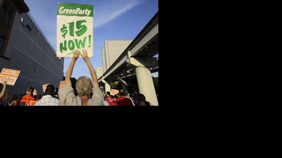 
Protestors march in support of raising the minimum wage to $15 an hour Wednesday.
