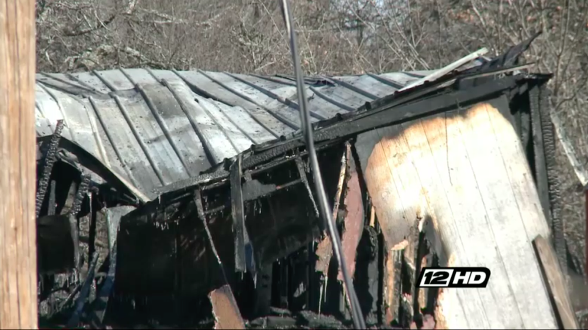 A fire tore through a mobile home in Oklahoma on Wednesday, killing a boy who tried to save his paralyzed father from the flames.