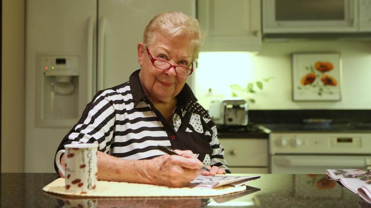 Barb Shaeffer, 85 when this photo was taken, works on one of the two crossword puzzles she did every morning in her kitchen in Chicago, Illinois, August 16, 2012. Shaeffer is part of a Northwestern study of superagers, elderly people who continue to stay cognitively sharp even as they age.