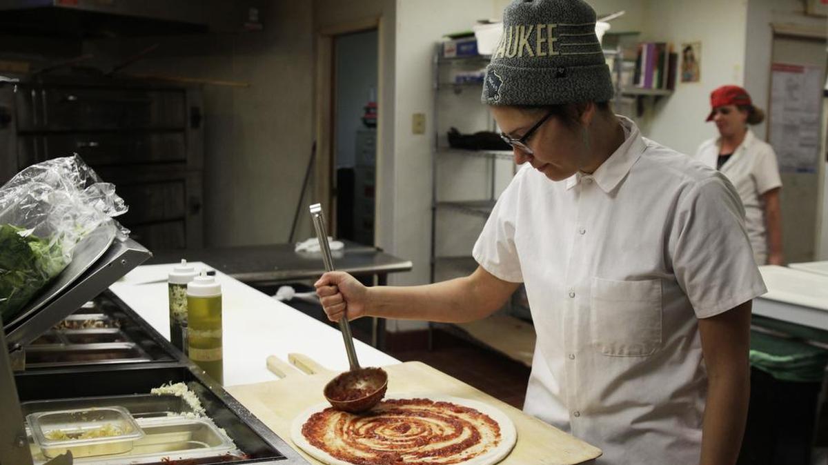 Andrea Ledesma, 28, has a four-year degree and quit a higher-paying job because it made her miserable. Now she’s working at a pizza restaurant in Milwaukee, making $18,000 a year.