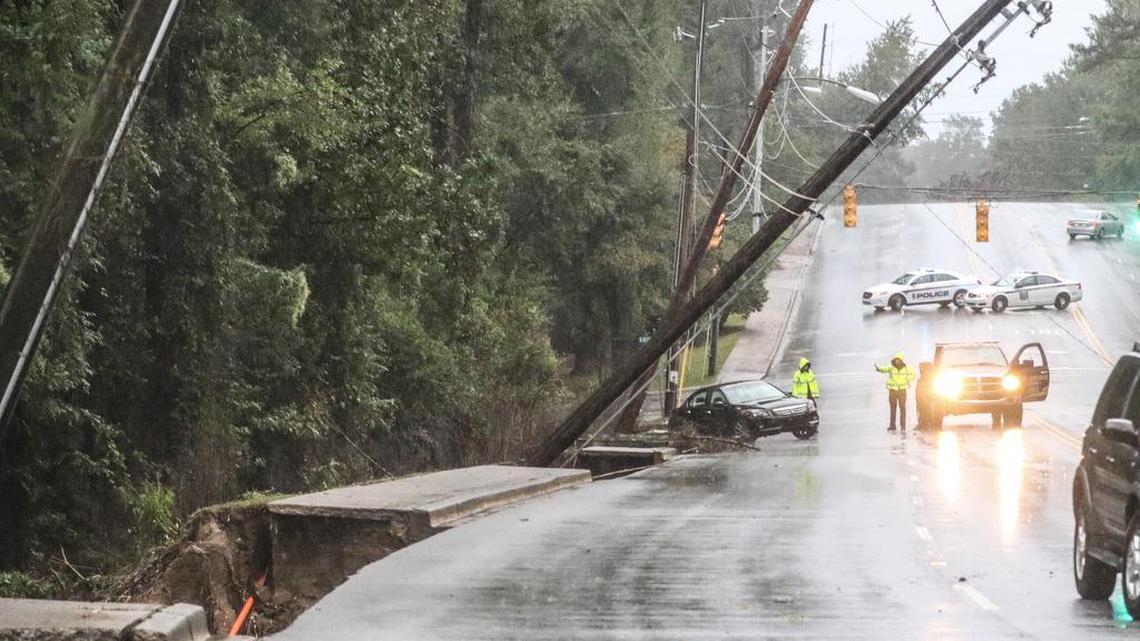 The sidewalk and powerlines on Beltline Blvd gave way to Gills Creek during Sunday morning's flood on October 4, 2015.