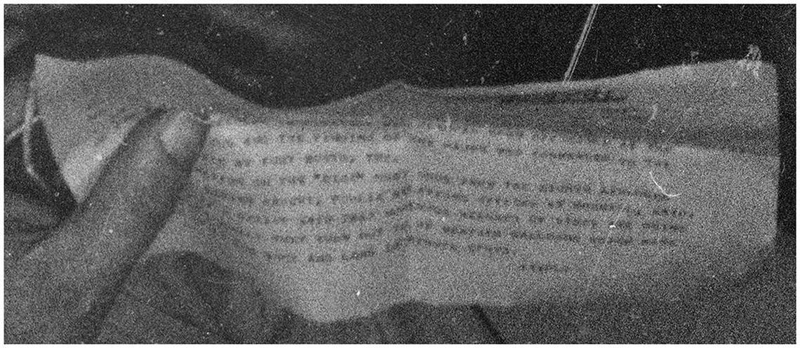 “If we could only read what it says,” Iowa researcher Kevin Randle says of the paper in Brig. Gen Roger Ramey’s hand.