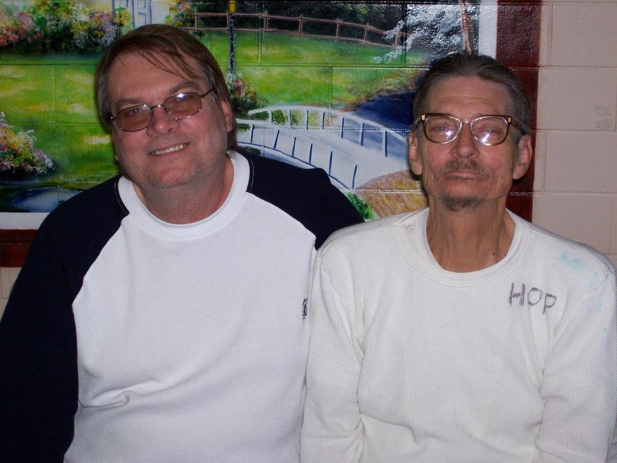 Richard “Grasshopper” Liggett, right, with his brother John Liggett, during a visit at Angola prison in Louisiana. Richard Liggett was a master carpenter at Angola who built caskets. His name is one of three burned into the wood on Rev. Billy Graham’s casket.