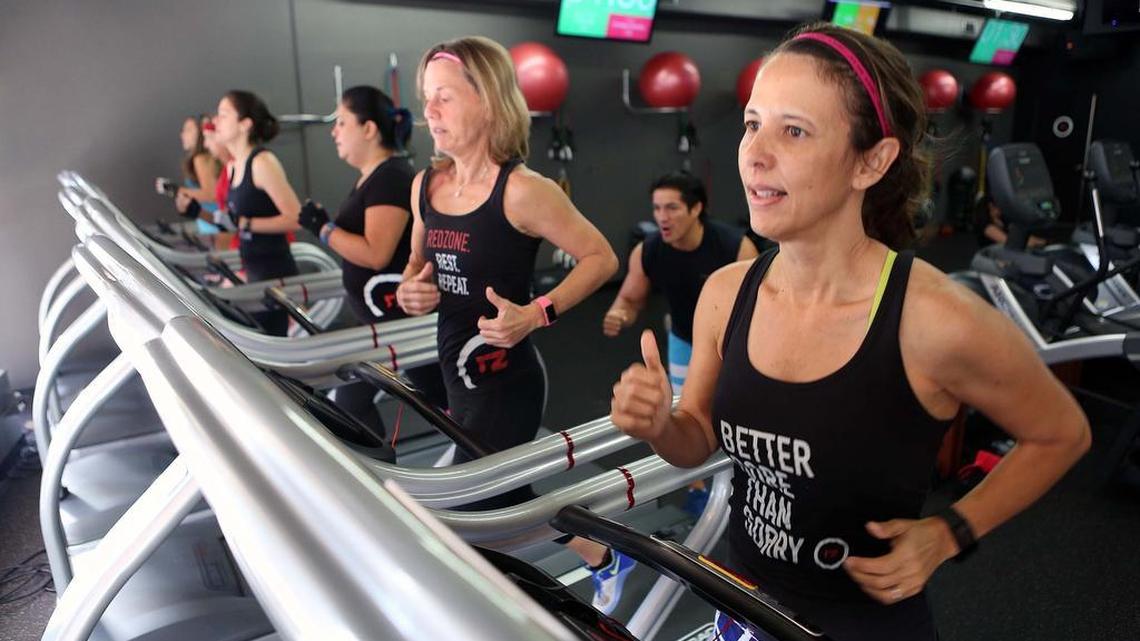 Miami banker Tanya Masi, 50, right, works out at Red Zone Fitness in Coral Gables with an “over 40” group of women.