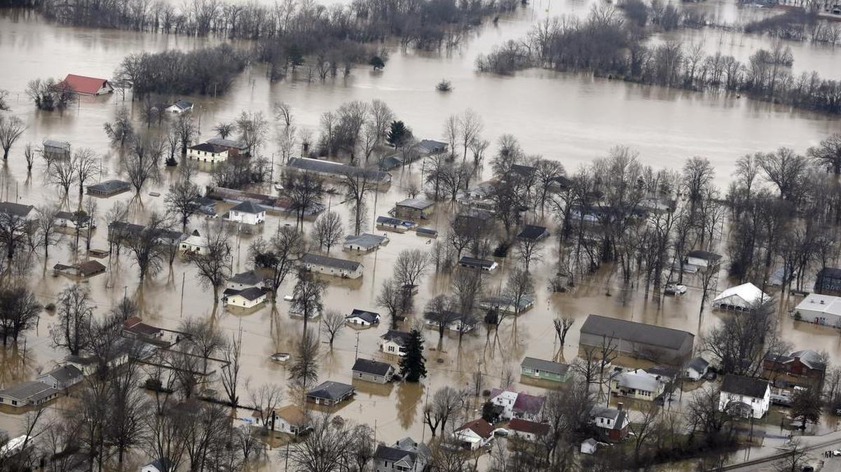 In this aerial photo, homes are surrounded by floodwater Dec. 30, 2015, in Pacific, Mo. A rare winter flood threatened nearly two dozen federal levees in Missouri and Illinois as rivers rose, prompting evacuations in several places.