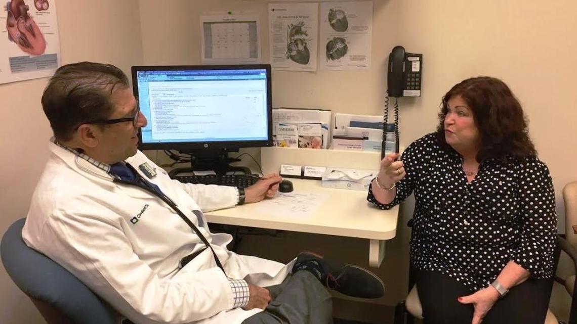 Dr. David Wolinsky, medical director of cardiac rehabilitation at Cleveland Clinic, consults with his patient Kathleen Slater. The Coral Springs mother of two had atrial fibrilation four years ago and through diet, exercise, medication and checkups, has maintained good health.