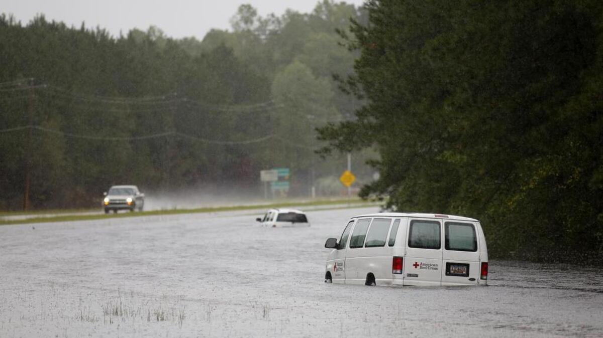 
An American Red Cross van is stranded in floodwaters on U.S. Highway 17 North near Georgetown, S.C., on Sunday, Oct. 4, 2015. Several sections of Highway 17 are shut down between Charleston and Georgetown
