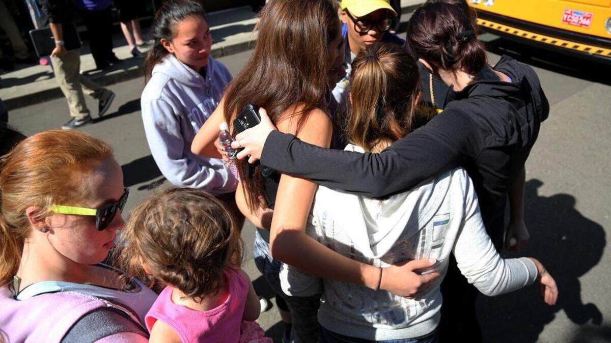 
Friends and family are reunited with students at the local fairgrounds after a mass shooting at Umpqua Community College, in Roseburg, Thursday, Oct. 1, 2015. Multiple people were killed after a gunman opened fire at the campus early Thursday.
