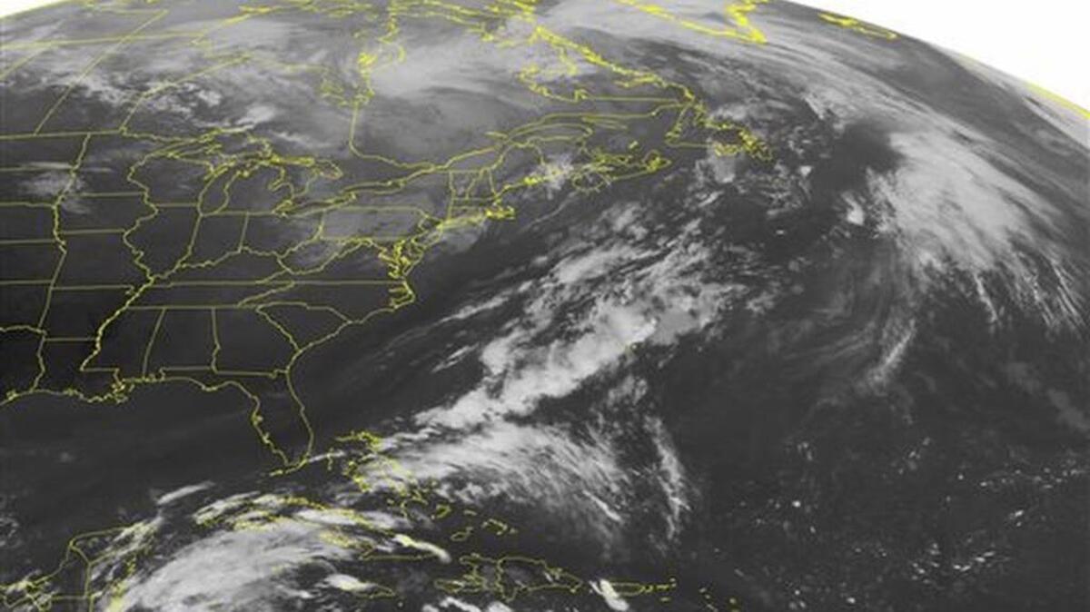 This NOAA satellite image taken Tuesday, Oct. 20, 2015, at 12:45 AM EDT shows an area of low pressure over the upper Mississippi Valley into the northern Great Lakes. The system's warm front will bring rain showers to Michigan and Ontario as it moves eastward. Further south, a stationary boundary continues to produce rain showers across southern Florida. A broad area of high pressure over the Eastern Seaboard is promoting mostly sunny skies from New England into the Mid-Atlantic and the Carolinas.