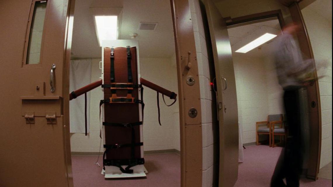 As a reporter walks through the rooms, the table that will be used in the execution of Gary Lee Davis stands upright in the Colorado State Penitentiary in Canon City, Colo., on Sept. 24, 1997. Davis, who killed a Byers, Colo., woman in 1986, will be put to death on Monday, Oct. 13, the first person to be executed in Colorado since Luis Jose Monge was put to death 30 years ago for killing his wife and three of his children. (AP Photo/David Zalubowski)