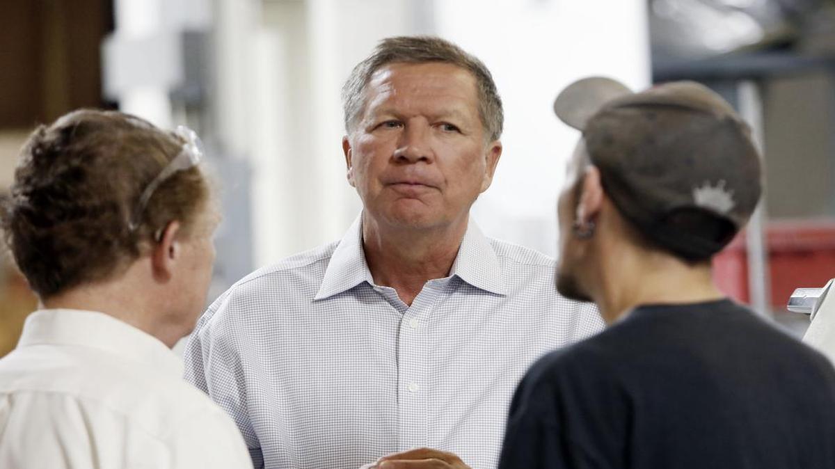 
Ohio Gov. John Kasich enters the race for the Republican presidential nomination Tuesday, July 21, 2015. He maintains that as governor of a state that's the "microcosm of the country" he's uniquely qualified to lead the nation. In photo, Kasich talks with employees at RP Abrasives, in Rochester, N.H., July 13, 2015.
