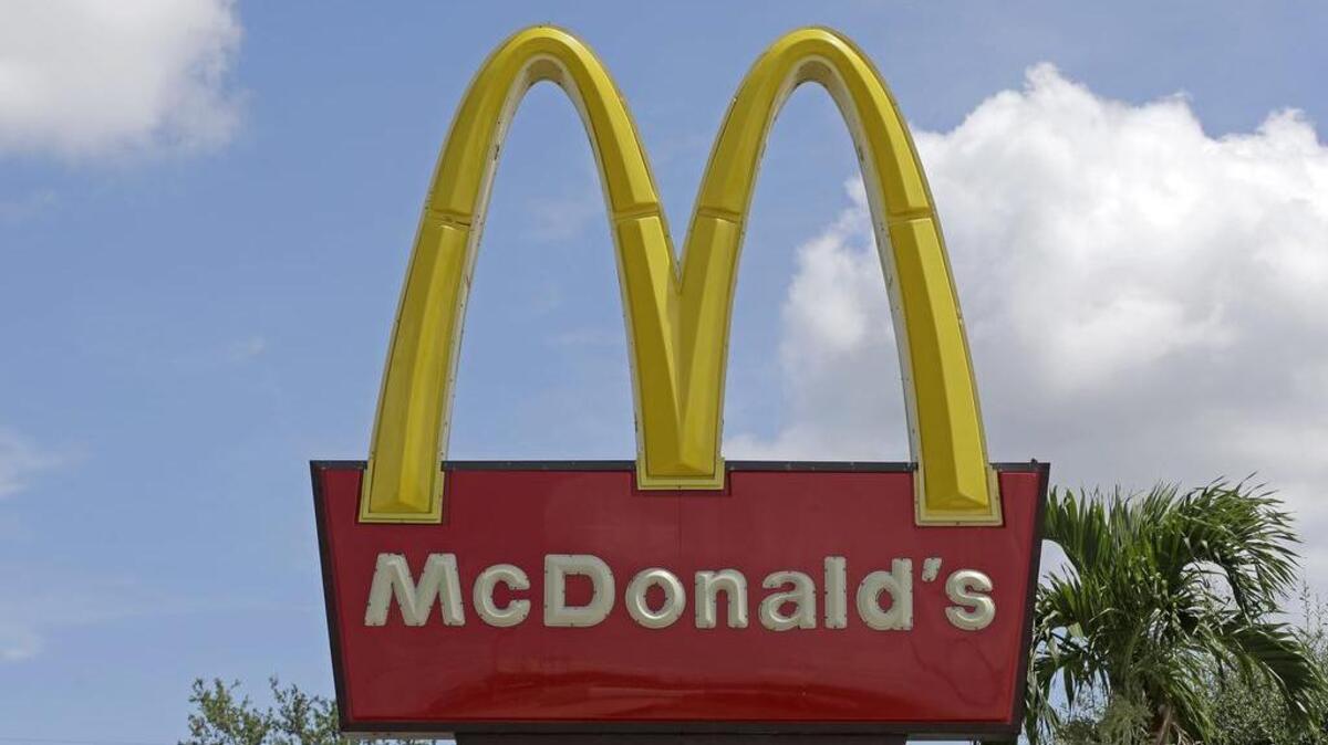 At McDonald's, the grill tops won't release until a burger has been on the heat for a certain number of minutes.