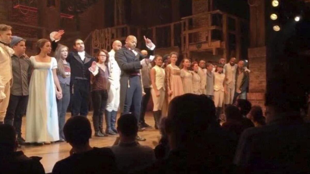 In this image made from a video provided by Hamilton LLC, actor Brandon Victor Dixon who plays Aaron Burr, the nation’s third vice president, in "Hamilton," speaks from the stage after the curtain call in New York on Friday. Vice President-elect Mike Pence is the latest celebrity to attend the Broadway hit "Hamilton," but the first to get a sharp message from a cast member from the stage.