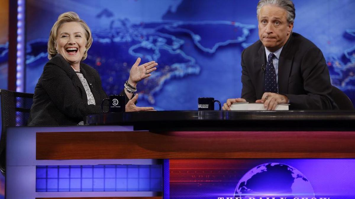 
 In this July 15, 2014 file photo, former U.S. Secretary of State Hillary Rodham Clinton reacts to host Jon Stewart during a taping of "The Daily Show with Jon Stewart," in New York. After more than 16 years and nearly 2,600 telecasts, Stewart will end his show on Aug. 6.
