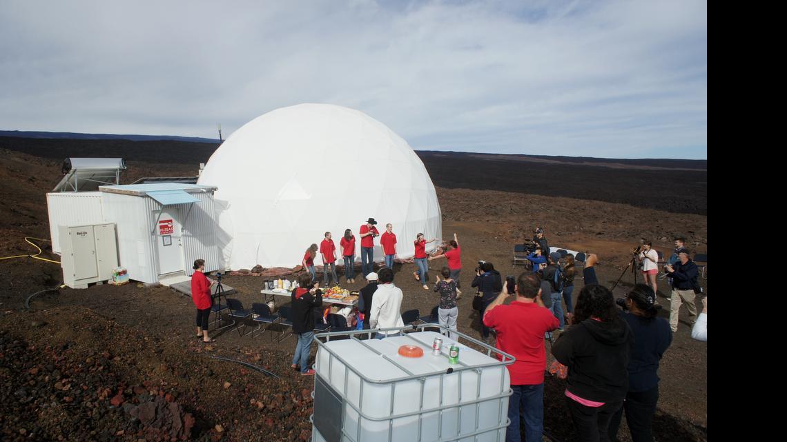 
In this photo provided by the University of Hawaii at Manoa HI-SEAS Human Factors Performance Study, six scientists exit a dome that they lived in as part of an isolated existence to simulate life on a mission to Mars, on the bleak slopes of dormant volcano Mauna Loa near Hilo on the Big Island of Hawaii, Saturday, June 13, 2015. 
