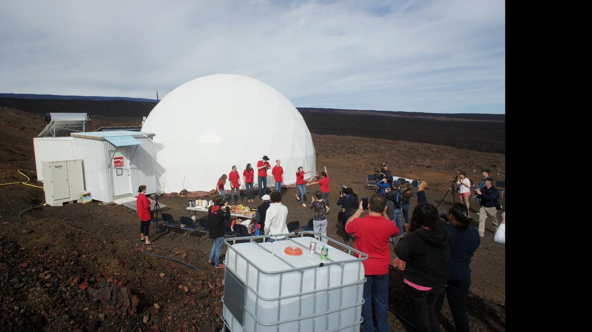 
In this photo provided by the University of Hawaii at Manoa HI-SEAS Human Factors Performance Study, six scientists exit a dome that they lived in as part of an isolated existence to simulate life on a mission to Mars, on the bleak slopes of dormant volcano Mauna Loa near Hilo on the Big Island of Hawaii, Saturday, June 13, 2015. 
