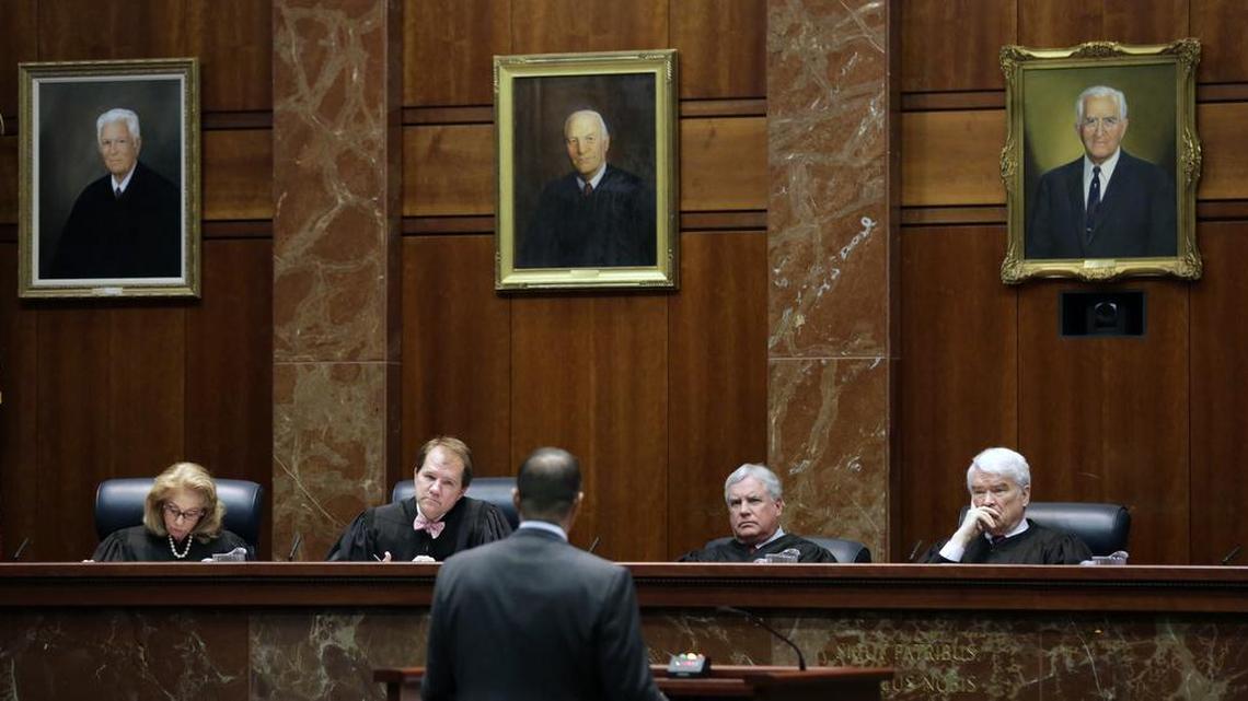 Texas Supreme Court justices, from left, Debral Lehrmann, Don Willett, Paul Green, and Nathan Hecht listen as attorney Chad Baruch argues in a case for a home-schooling family in El Paso accused of failing to teach its kids anything because they were waiting for the second coming of Jesus Christ, Monday, Nov. 2, 2015, in Austin, Texas. The family says the kids were educated and that the El Paso school district is anti-Christian. The district counters that it should be allowed to investigate complaints learning isn't taking place.