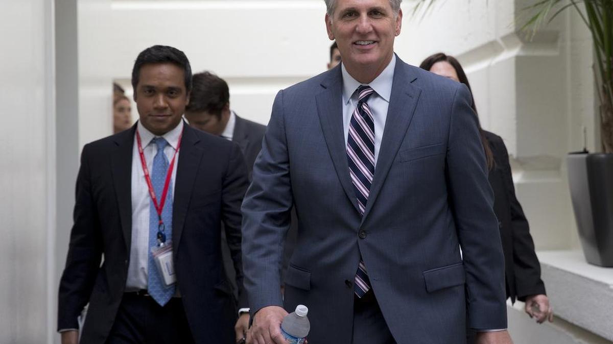 
House Majority Leader Kevin McCarthy of California, right, arrives for a House Republican Conference on Capitol Hill in Washington, Tuesday, Sept. 29, 2015. 
