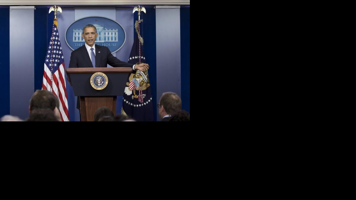 
President Barack Obama speaks during a news conference in the Brady Press Briefing Room of the White House in Washington, Friday, Dec. 19, 2014. The president said the US is making significant strides where it counts, beginning with the economy. 
