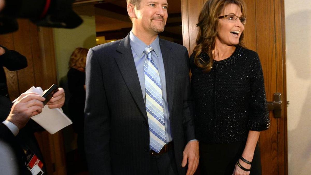 Sarah Palin and her husband, Todd, arrive at the Grove Park Inn for a celebration of Billy Graham’s 95th birthday in Asheville, NC, on Thursday, Nov. 7, 2013.