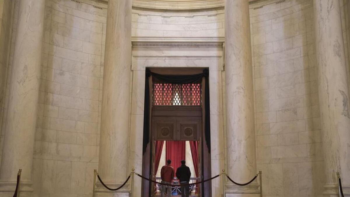 Black crepe frames the doorway to the courtroom at the Supreme Court in Washington, where Justice Antonin Scalia will lie in repose Friday.