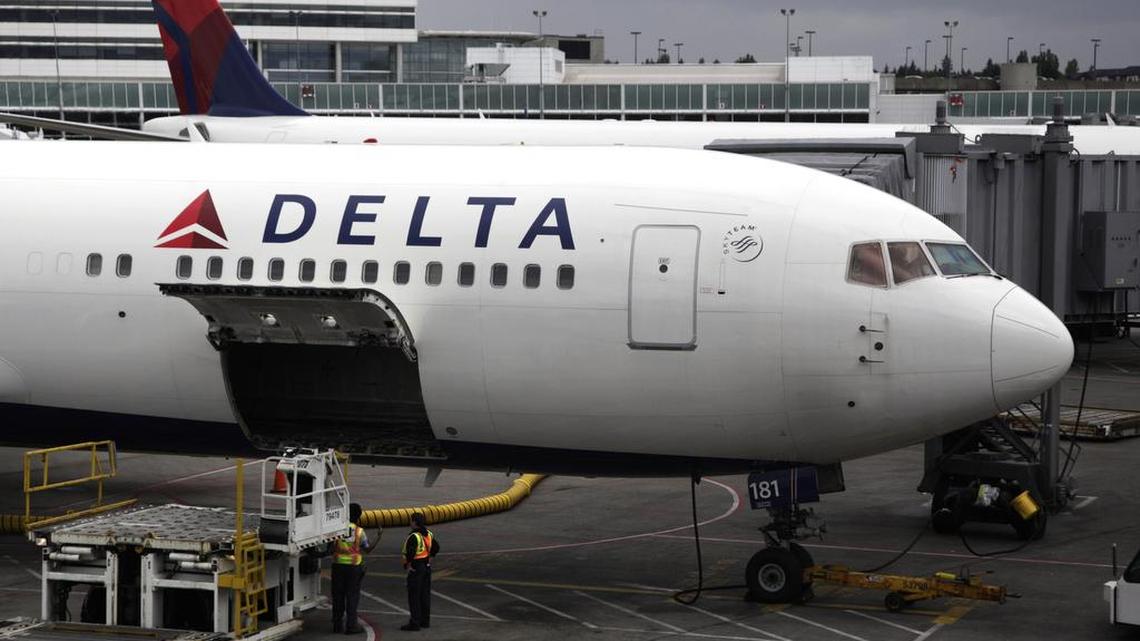 FILE - In this file photo made June 7, 2010, a Delta Airlines Inc. plane sits on the tarmac at Seattle-Tacoma International Airport in Seattle.