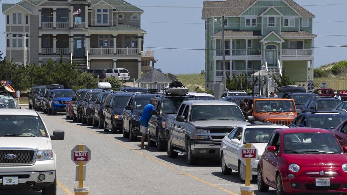 Passengers wait to board a ferry in Hatteras, N.C. for the trip to Ocracoke Island on Wednesday, June 17, 2015.