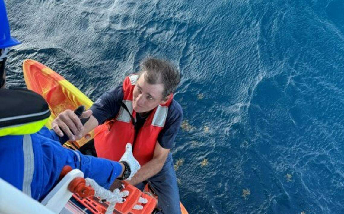 Two men were rescued by Carnival Cruise Line crew members.