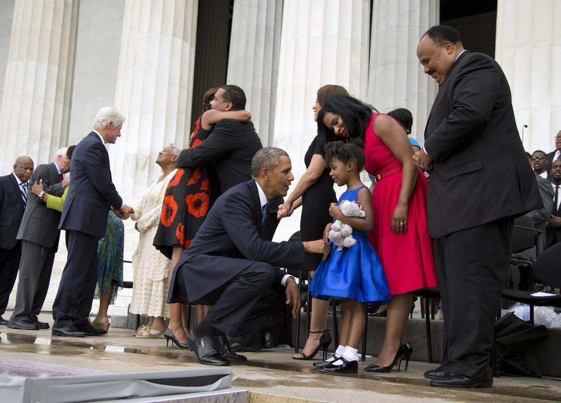 President Barack Obama talks with Yolanda Renee King, 5, granddaughter of Martin Luther King Jr., her mother, Arndrea Waters, and Martin Luther King III after speaking at a ceremony commemorating the 50th anniversary of the March on Washington on Aug. 28, 2013, at the Lincoln Memorial in Washington.