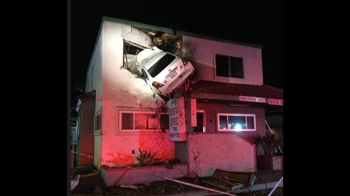 A car hit a median and flew into the second floor of a building in Santa Ana, California, on Saturday night.