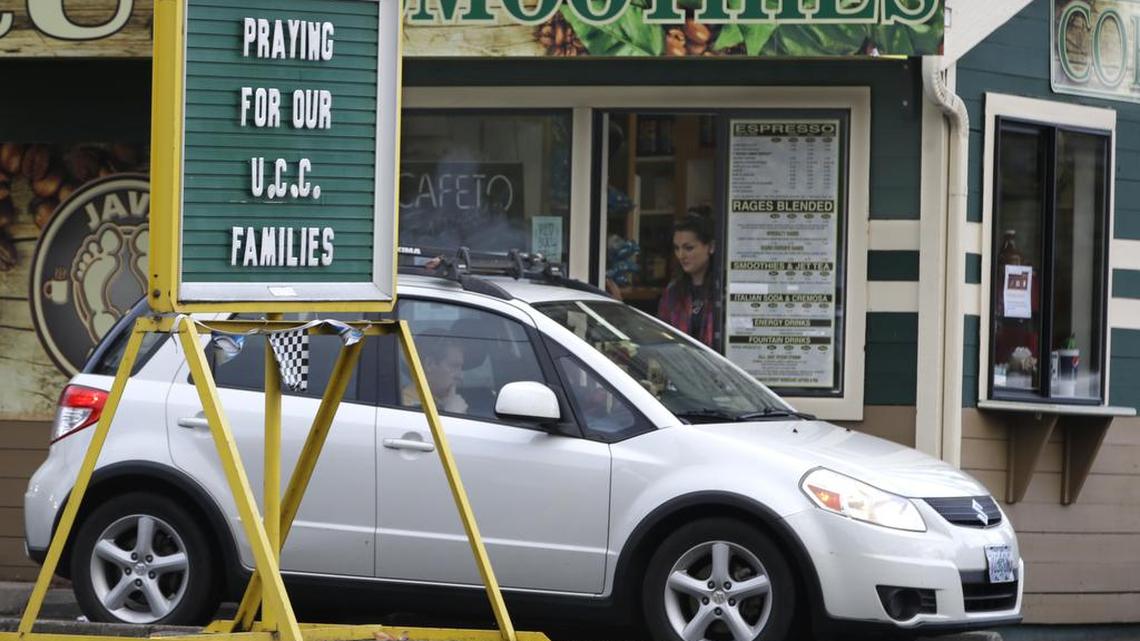 
A sign in remembrance for those killed in a fatal shooting at Umpqua Community College, is displayed at a local business on Saturday, Oct. 3, 2015, in Roseburg, Ore. Armed with multiple guns, Chris Harper Mercer, 26, walked in a classroom at the community college, Thursday, and opened fire, killing several and wounding several others.

