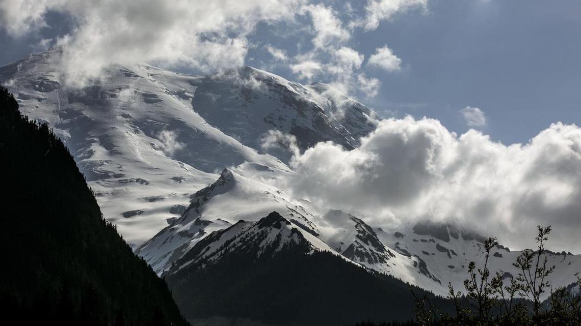 A Chinook helicopter crew and other rescue teams were working Monday to reach a 58-year-old man from Norway who is missing on Mount Rainier. He and a 41-year-old Canadian woman apparently took shelter at about 11,000 feet when a fierce winter storm hit the mountain Saturday evening.
