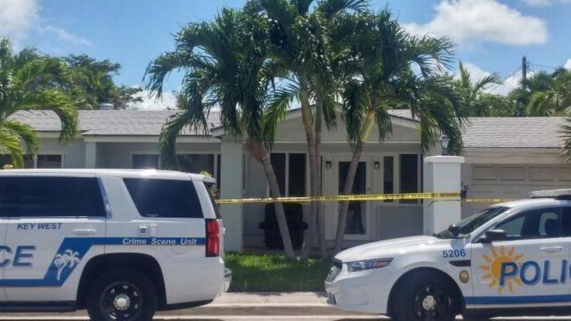 Police surround a house in Key West Monday afternoon after what detectives called a brutal domestic-violence attack on a man.