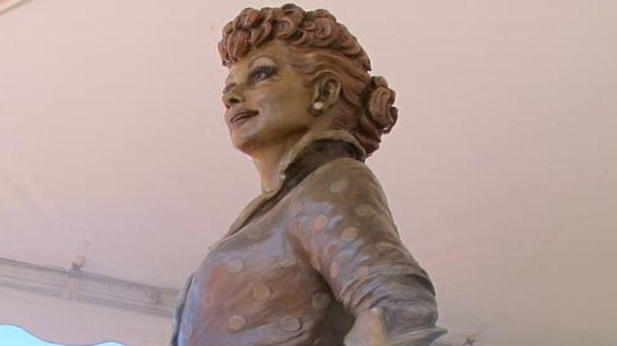 People gather at the unveiling of the new Lucille Ball statue at Memorial Park in Celoron, N.Y: the late actress’s home town, Saturday, Aug. 6, 2016. The statue, by sculptor Carolyn Palmer, replaces a previous statue of the actress that was referred to as “Scary Lucy.” The new statue is being shown as part of this year’s “Lucille Ball Comedy Festival.”