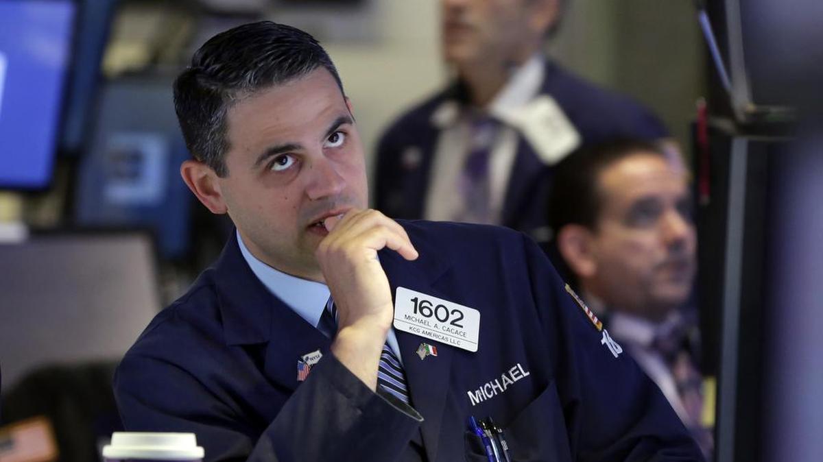 
Specialist Michael Cacace works on the floor of the New York Stock Exchange, Tuesday, Aug. 25, 2015. In a volatile market, experts say, the best course is to sit tight. Selling at a loss usually isn’t a good long-term strategy, especially for 401(k) investors.
