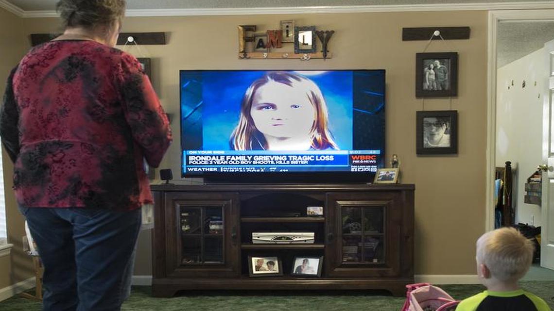 Tina Watson sometimes watches a taped news report about the shooting to remember Kimi and as a way to help Jaxon understand what happened.