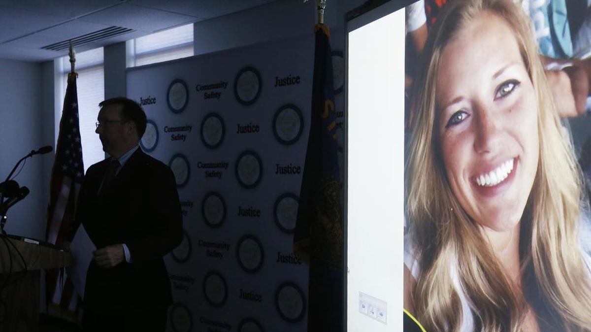 A picture of Kaylee Sawyer is displayed on a screen as Deschutes County District Attorney John Hummel speaks during a press conference on at the Deschutes County Courthouse in Bend, Ore. The murder of Kaylee Sawyer followed by a string of other crimes leading from Oregon through California allegedly committed by Central Oregon Community College safety officer Edwin Lara has this scenic mountain town deeply shaken.