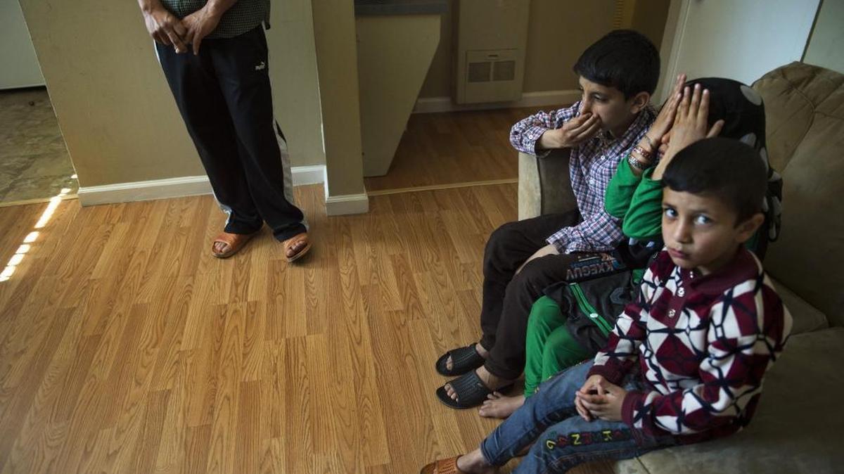 Afghan children in their home at the Balmoral Arms apartment in Arden Arcade in Sacramento, California.